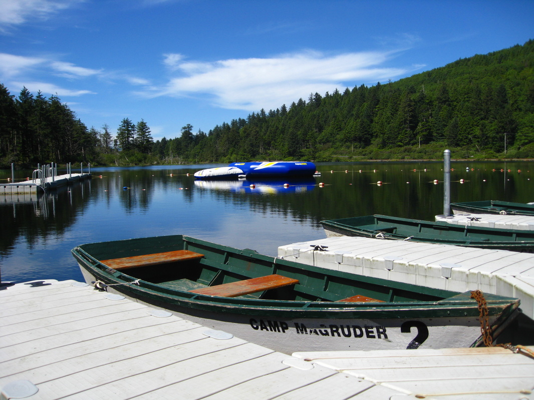 9274518_orig Rowboats at the dock on a lake at Camp Magruder.